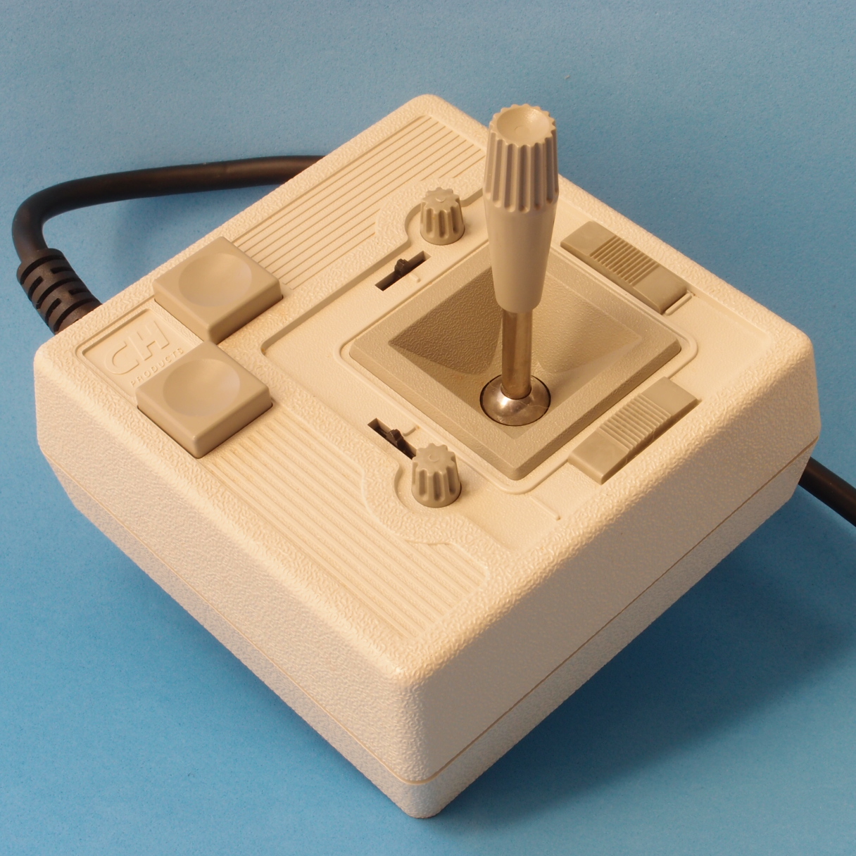 Classic joystick resting near game accessories