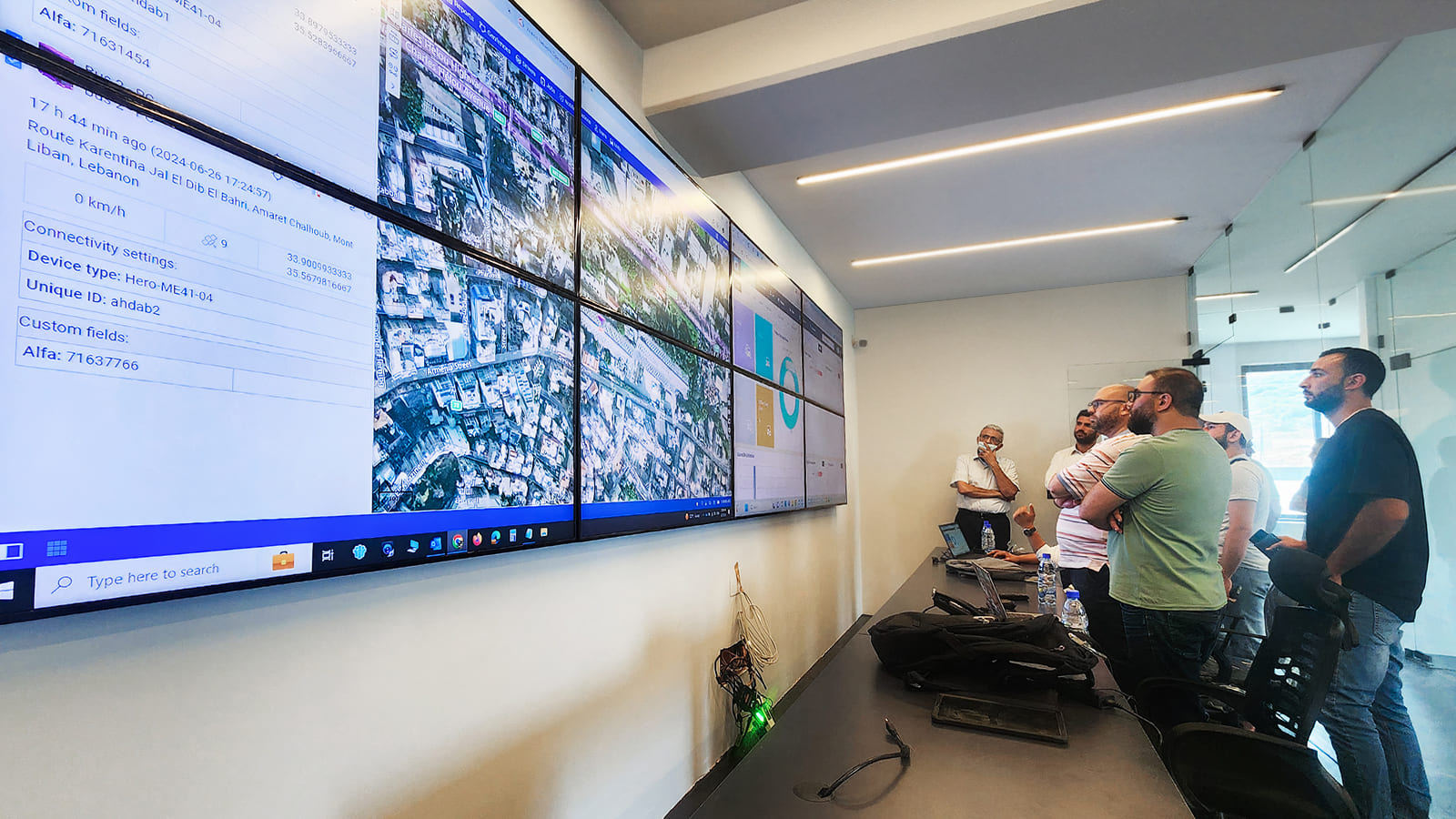 Real-time operations room with several displays used for monitoring activity