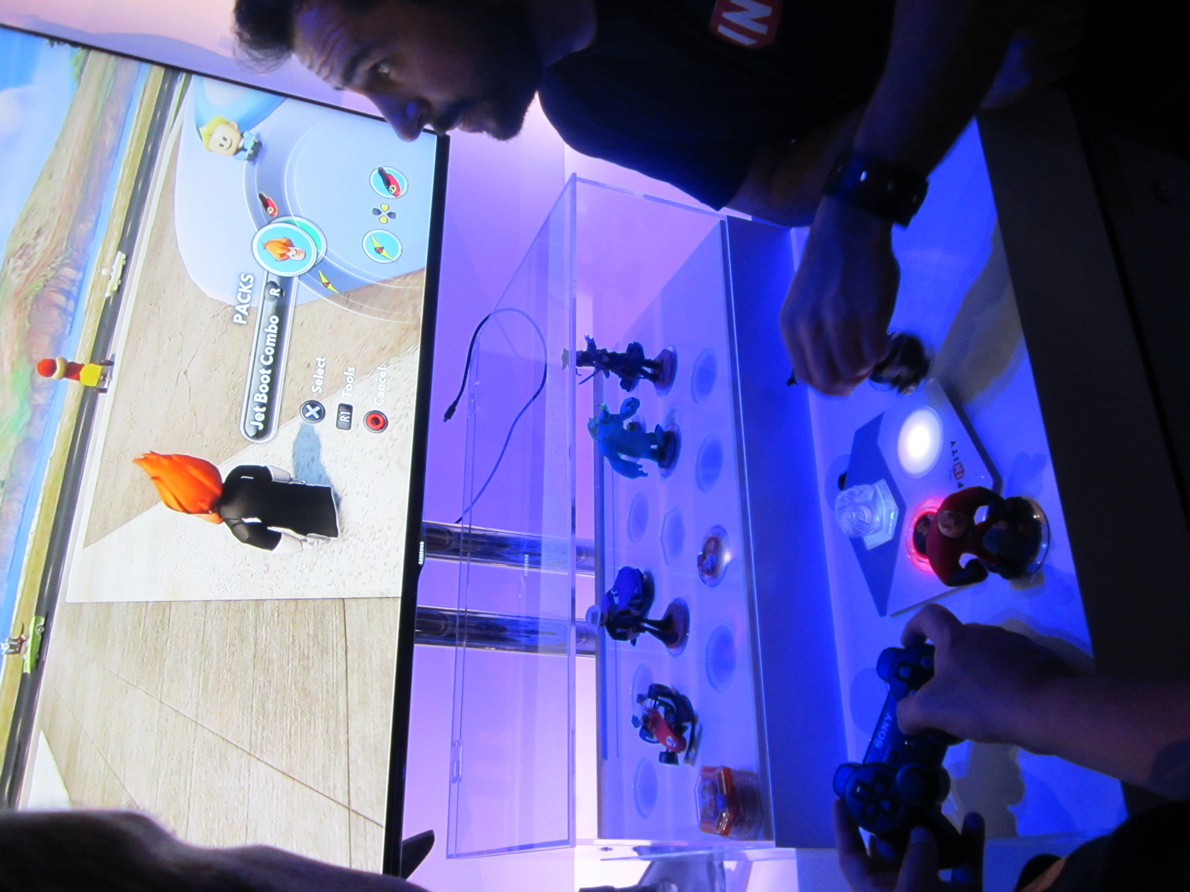 Disney Infinity display at E3 2013, showing Disney characters in a shared-play showcase