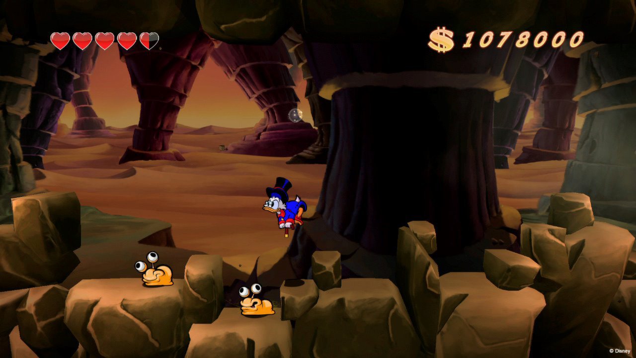 DuckTales Remastered gameplay screenshot showing Scrooge McDuck in a platforming stage
