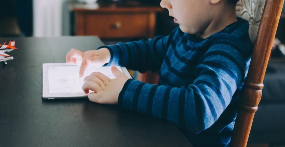 Young player using a tablet during a casual play session